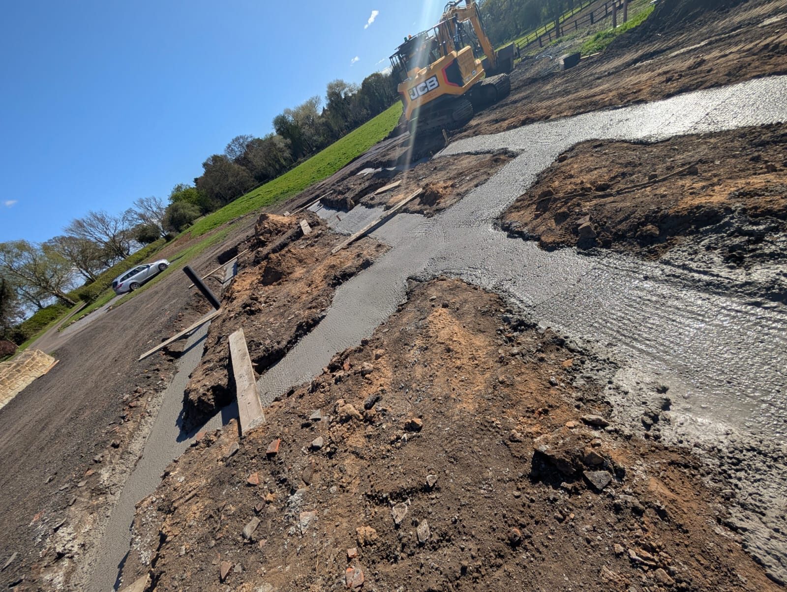 Groundworks under way, the digger opening up the foundations