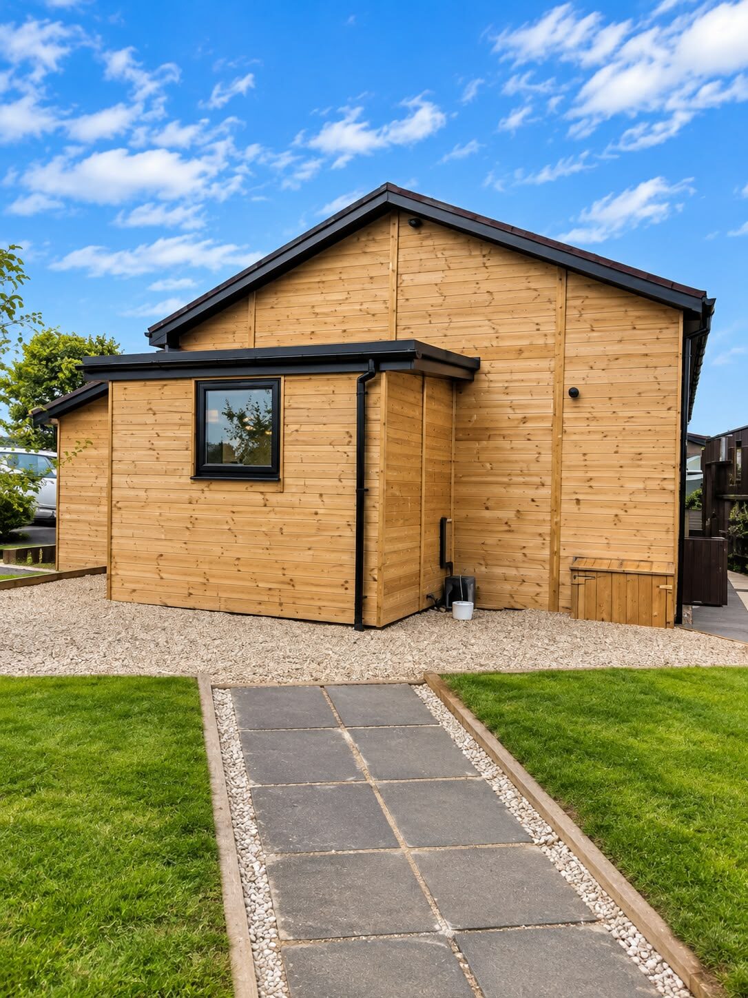Dunstanburgh Golf Club. A timber clad building on the course.