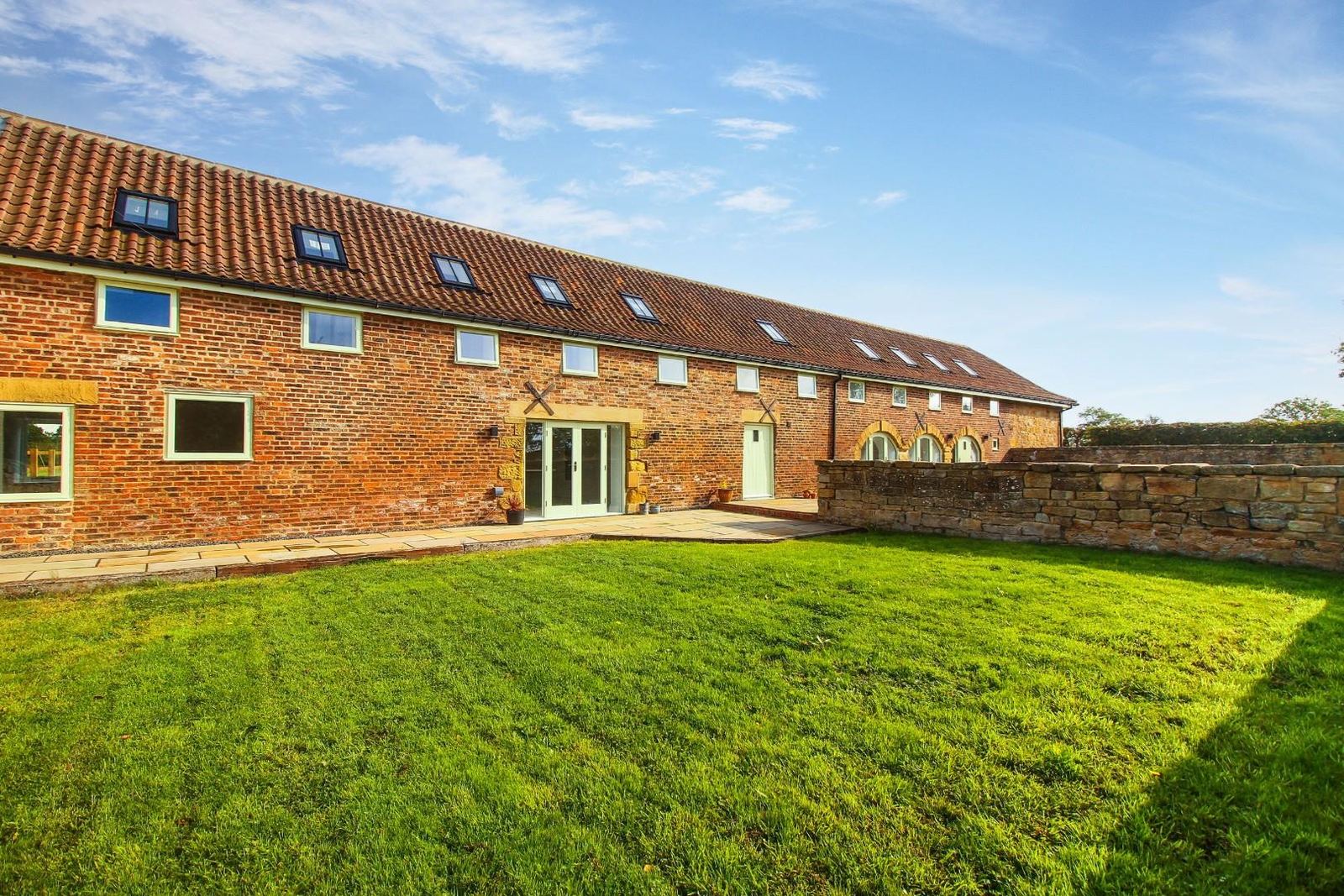 The farmhouse, built new alongside the barn.